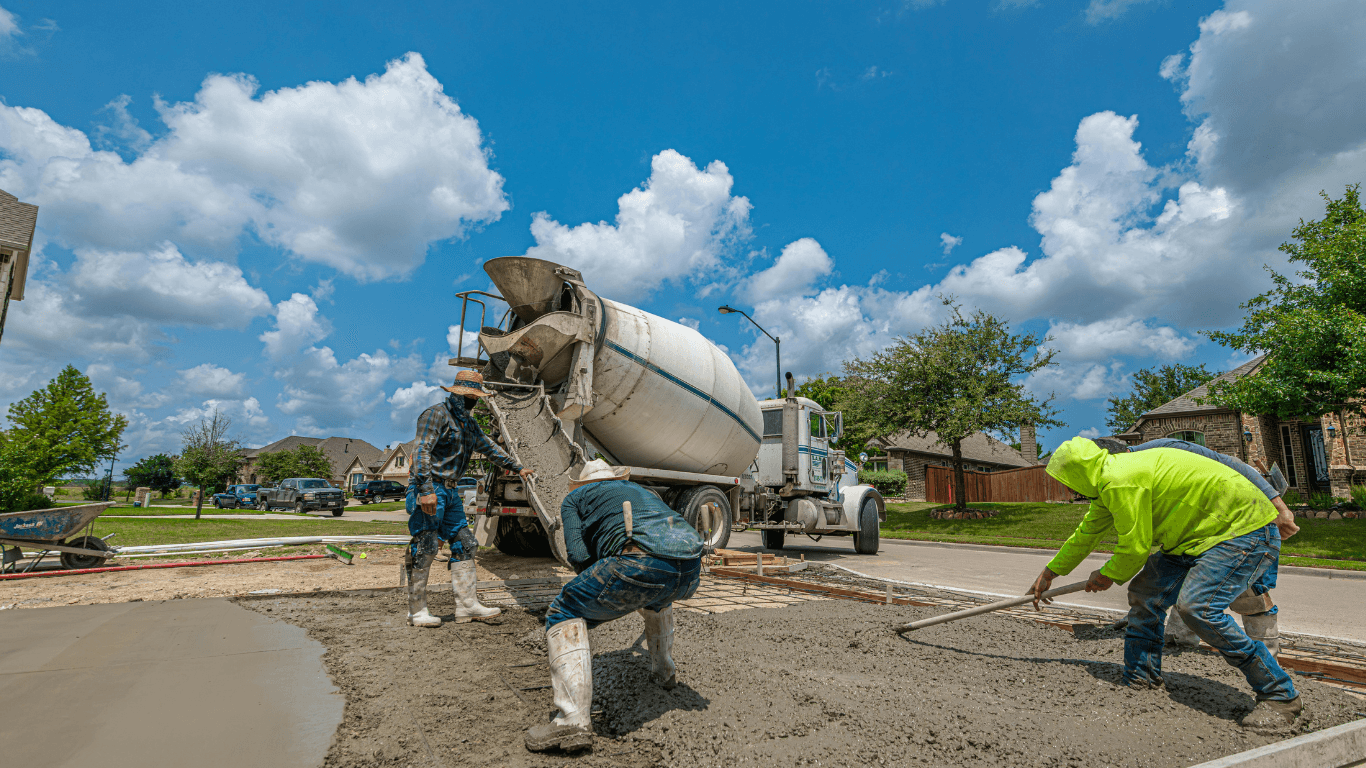 Construction workers pouring concrete