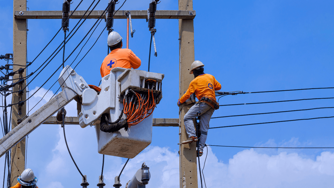 Utility workers on power lines