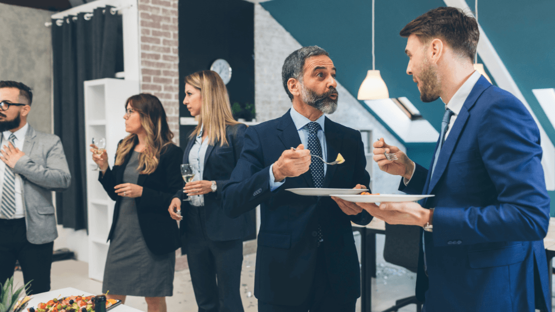 Investors talking at a professional networking event